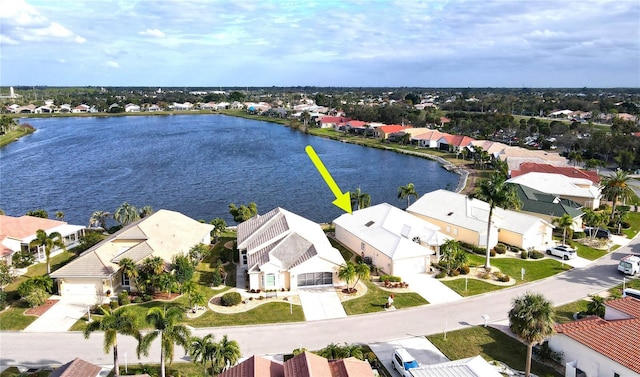 birds eye view of property with a water view