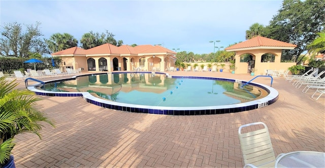 view of swimming pool featuring a gazebo and a patio