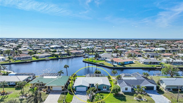 birds eye view of property featuring a water view