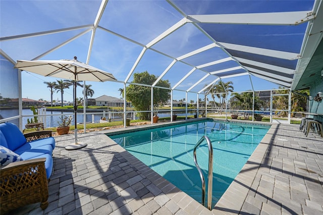 view of swimming pool featuring glass enclosure, an outdoor living space, a water view, and a patio