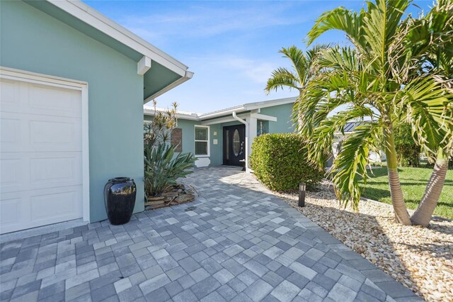 property entrance with a garage