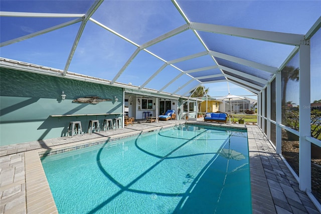 view of pool with a lanai and a patio area