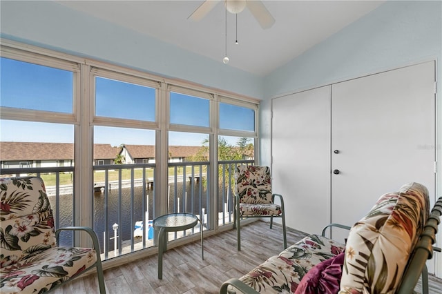 sunroom / solarium with vaulted ceiling and ceiling fan