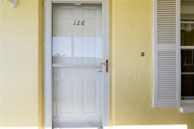 4000 Bal Harbor Blvd Unit 126, Punta Gorda, FL 33950 - entrance to property with stucco siding