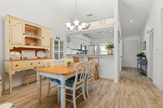 4000 Bal Harbor Blvd Unit 126, Punta Gorda, FL 33950 - dining room featuring a chandelier, light wood-type flooring, and recessed lighting
