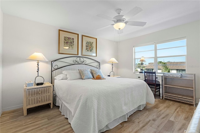 bedroom with ceiling fan and light hardwood / wood-style flooring