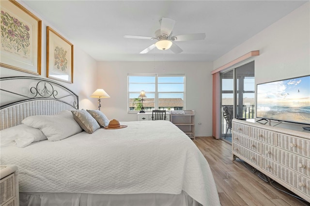 bedroom featuring access to exterior, light hardwood / wood-style flooring, and ceiling fan