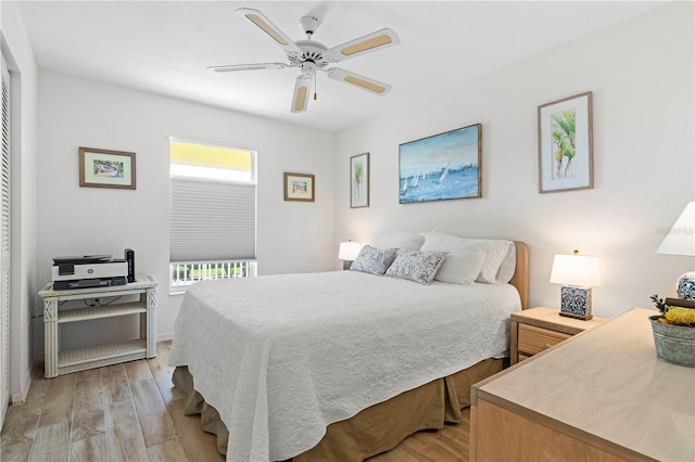 bedroom featuring ceiling fan and light hardwood / wood-style floors