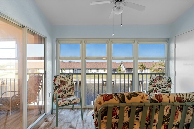 sunroom / solarium with ceiling fan and a wealth of natural light