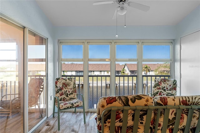 4000 Bal Harbor Blvd Unit 126, Punta Gorda, FL 33950 - sunroom featuring ceiling fan, wood finished floors, and healthy amount of natural light