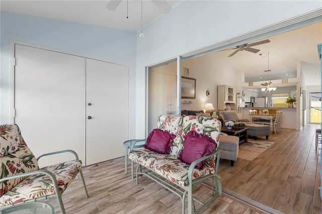 4000 Bal Harbor Blvd Unit 126, Punta Gorda, FL 33950 - living room with ceiling fan, a high ceiling, a chandelier, and wood finished floors