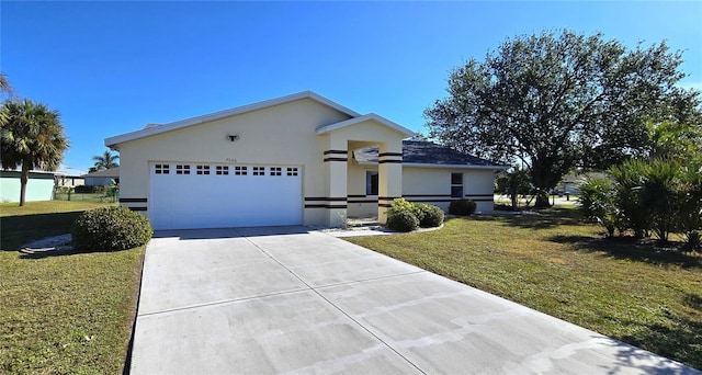 view of front facade with a front yard and a garage