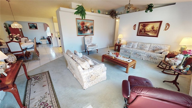 tiled living room featuring vaulted ceiling