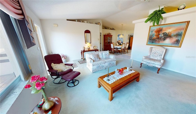 living room with carpet floors and vaulted ceiling