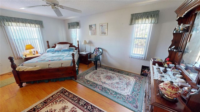 bedroom featuring ceiling fan and hardwood / wood-style floors