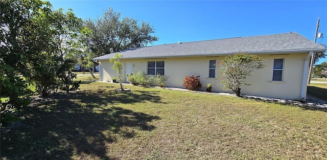 back of house with a yard