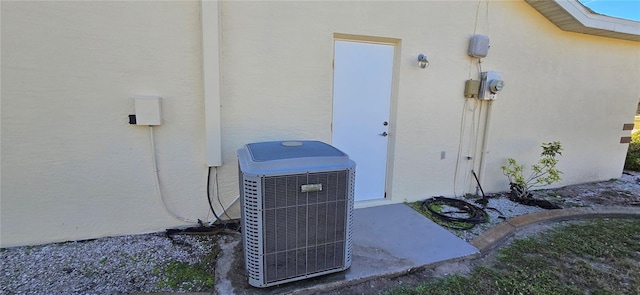 doorway to property featuring central air condition unit