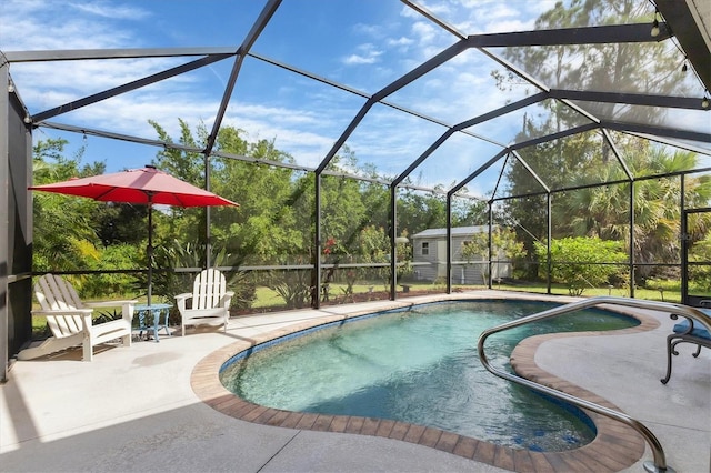 view of swimming pool featuring a storage unit, a lanai, and a patio