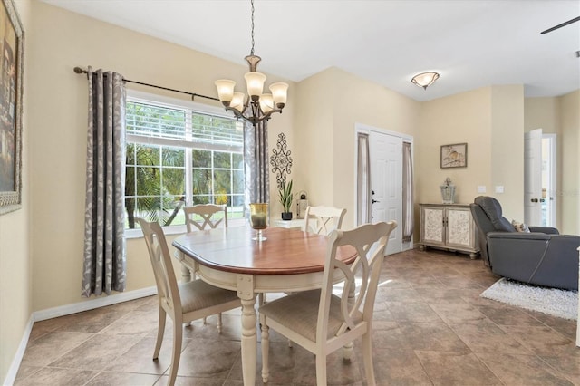 dining area featuring a notable chandelier