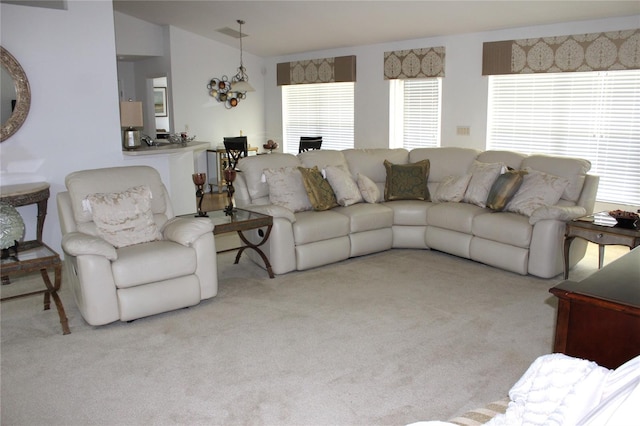 living room with light carpet and lofted ceiling