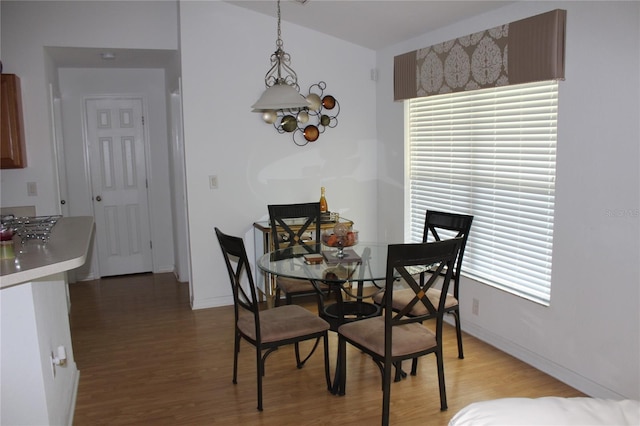 dining area with wood-type flooring