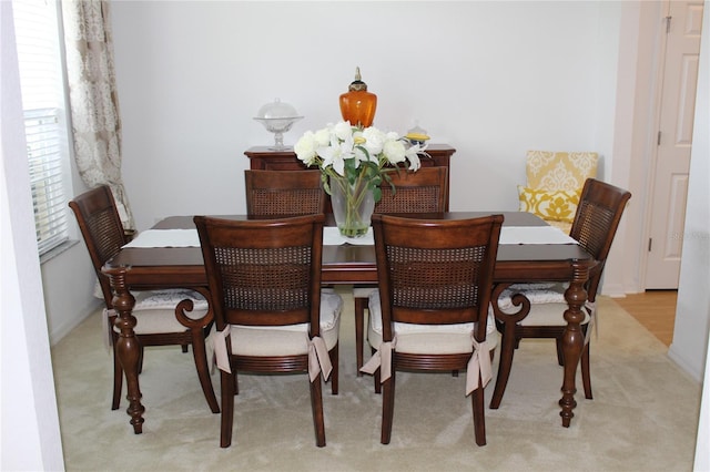 dining area with light carpet