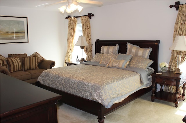 bedroom with light colored carpet and ceiling fan