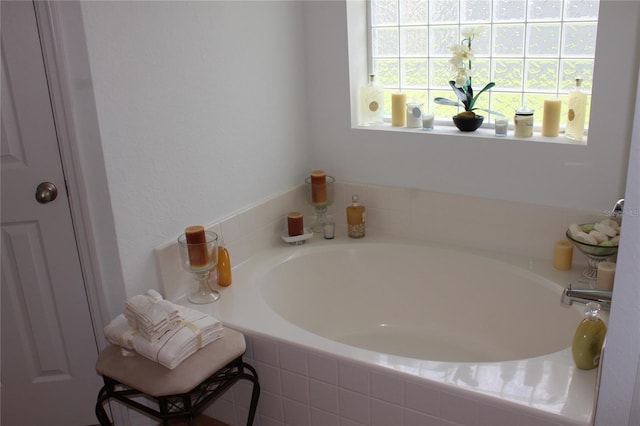 bathroom with tiled tub