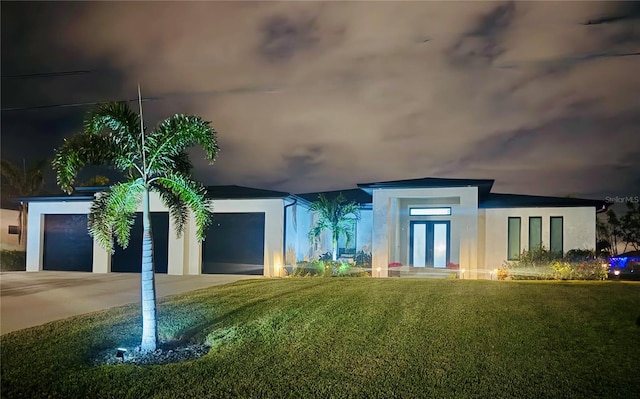 exterior space with french doors and a front lawn