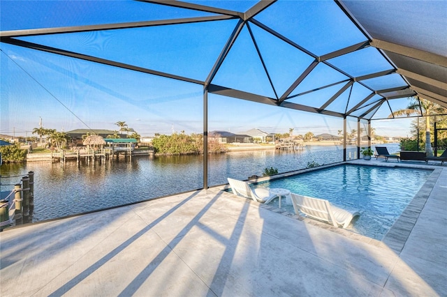 view of dock featuring a lanai, a patio area, and a water view