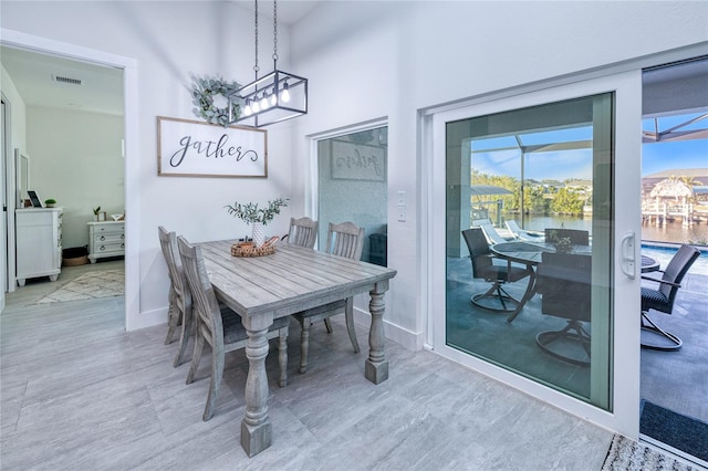 dining area featuring a water view