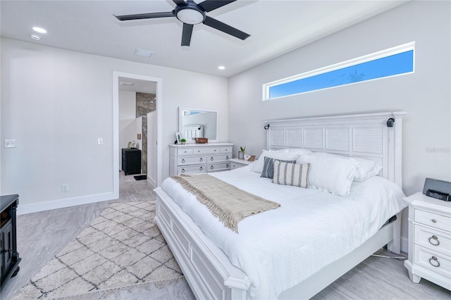 bedroom with ceiling fan and light hardwood / wood-style flooring