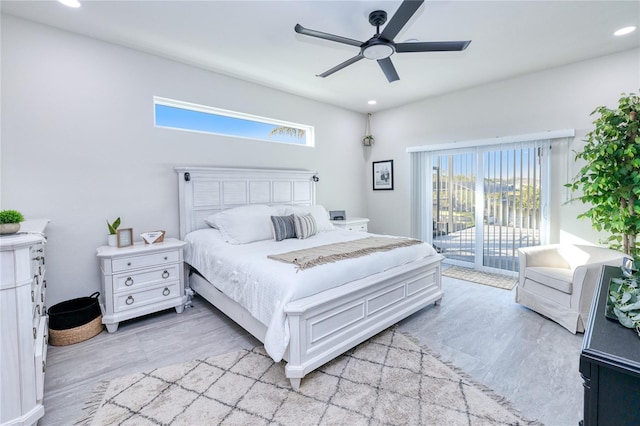 bedroom featuring access to exterior, light wood-type flooring, and ceiling fan