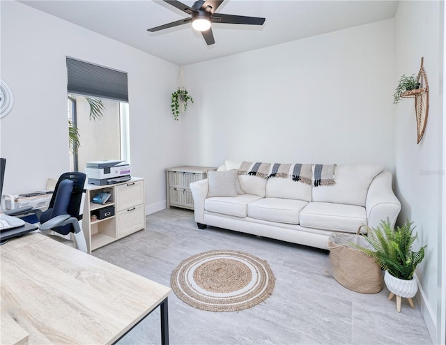 office space with light wood-type flooring and ceiling fan