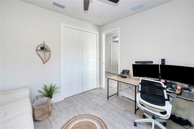 office with ceiling fan and light hardwood / wood-style floors