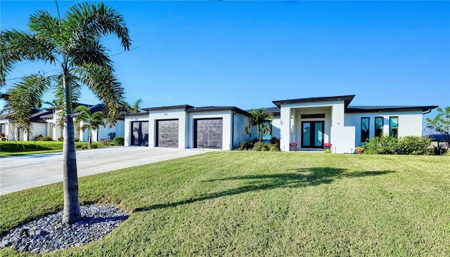 view of front facade featuring a front lawn and a garage