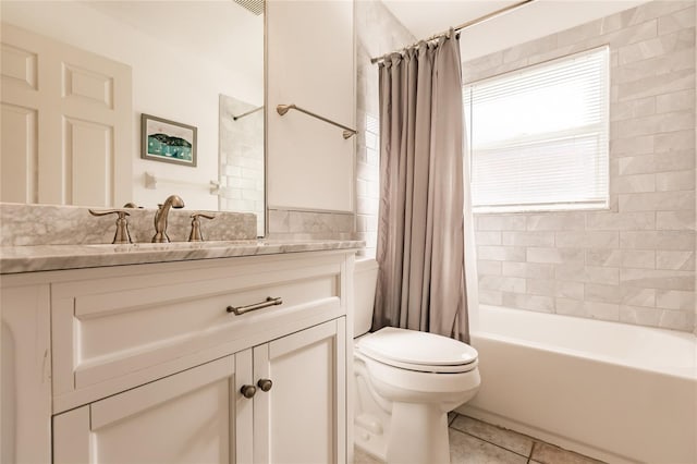 full bathroom featuring tile patterned floors, vanity, shower / bathtub combination with curtain, and toilet