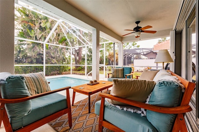 sunroom / solarium featuring ceiling fan