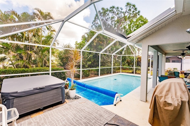 view of pool with a patio and a hot tub