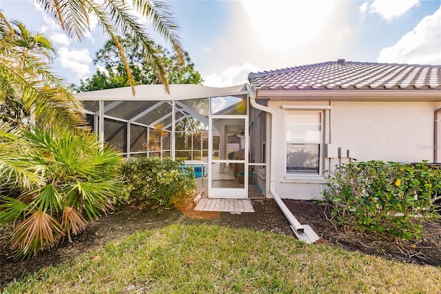 rear view of house with a lanai