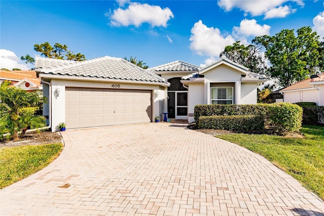 view of front of property with a garage