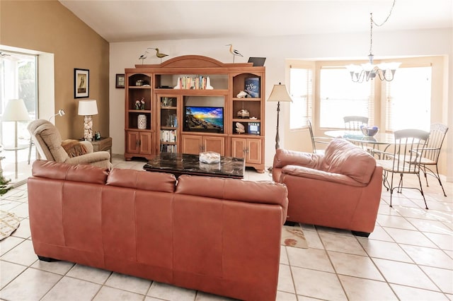 tiled living room with lofted ceiling and a notable chandelier