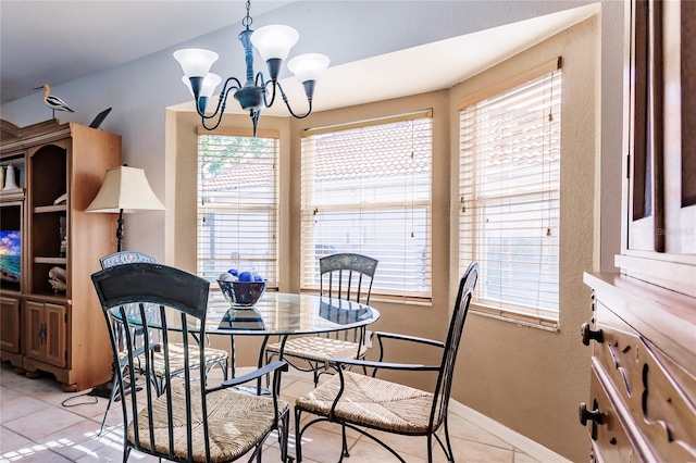 dining space with a chandelier, light tile patterned floors, and a healthy amount of sunlight