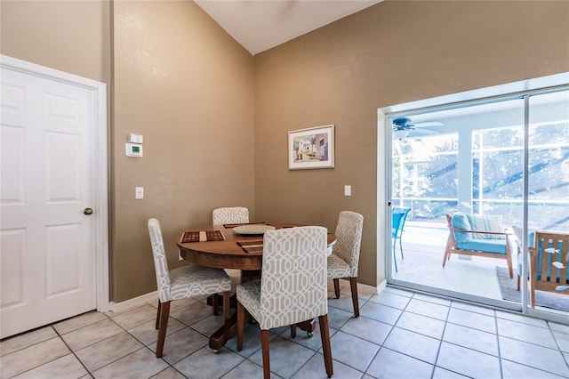 dining area featuring light tile patterned floors, ceiling fan, and lofted ceiling