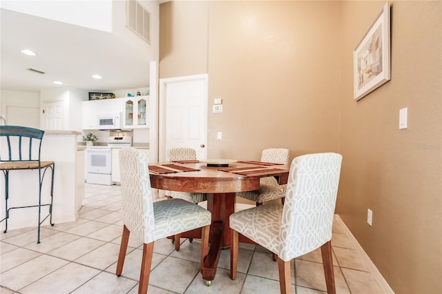 dining area featuring light tile patterned floors