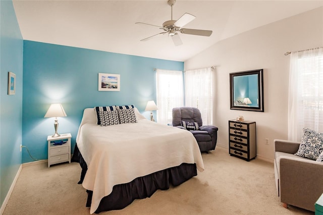 carpeted bedroom with ceiling fan and lofted ceiling