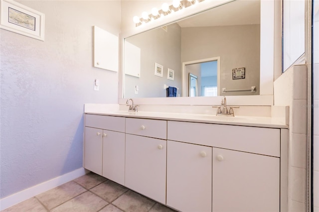 bathroom featuring tile patterned flooring and vanity