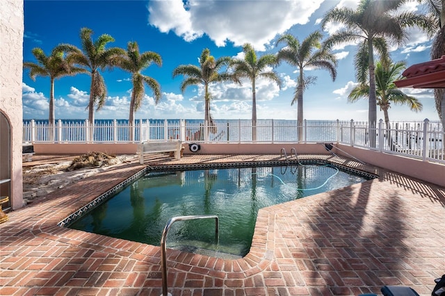 view of swimming pool with a patio area