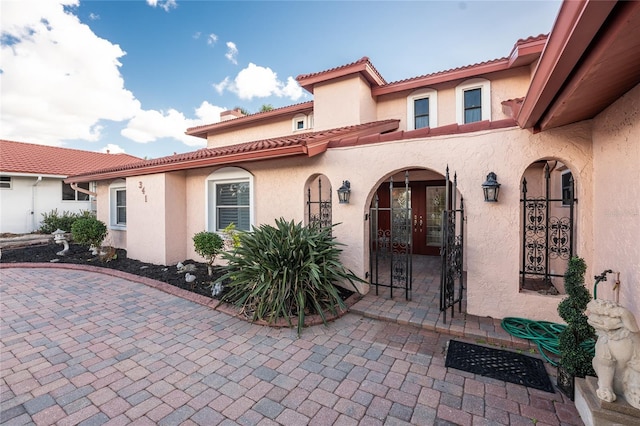 view of front facade featuring french doors and a patio area