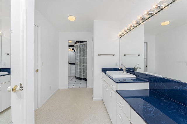 bathroom featuring tile patterned floors and vanity